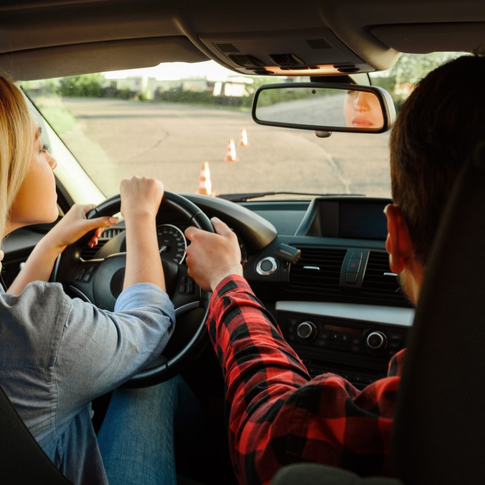 instructor-helps-woman-to-drive-the-car-1.jpg instructor-helps-woman-to-drive-the-car-1.jpg